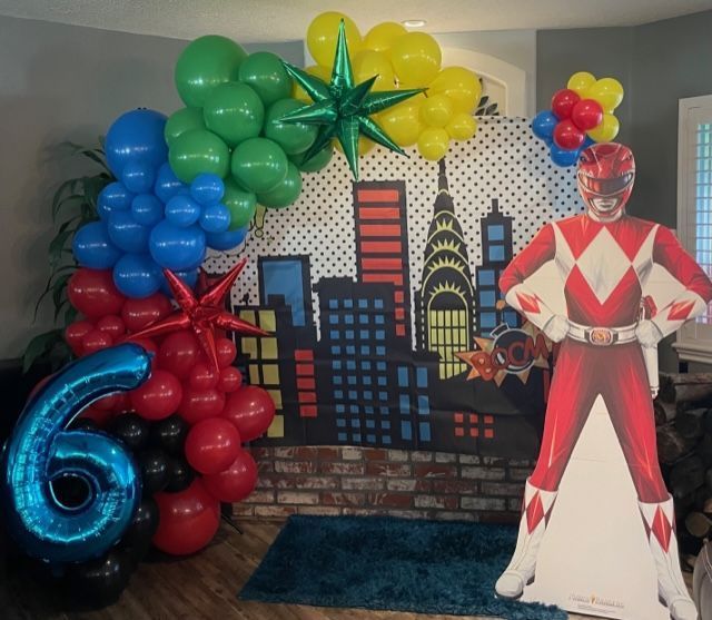 Balloon garland with comic city backdrop